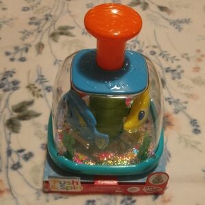 Push & Spin Toy - Orange, Blue, and Green